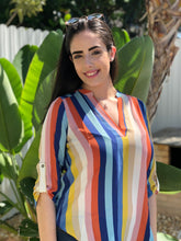 Load image into Gallery viewer, Multi-colored, vertical stripped blouse with V-Neck collar and long sleeves. Sleeves can be worn rolled up.