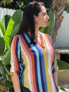 Multi-colored, vertical stripped blouse with V-Neck collar and long sleeves. Sleeves can be worn rolled up.