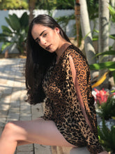 Load image into Gallery viewer, Leopard print romper with long open sleeves. Deep V neckline and ties in the front.